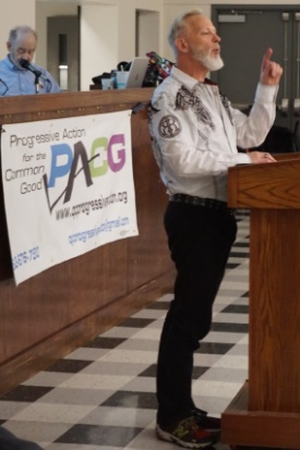 Reverend Richard Hendricks speaking at a podium